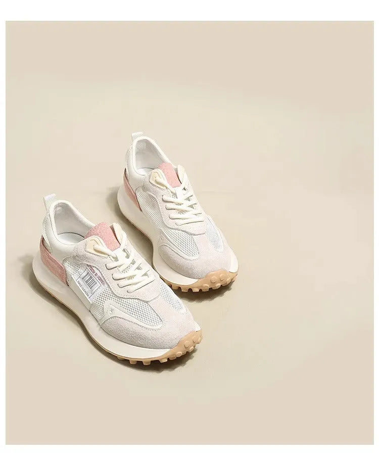 Women's grey and pink retro sneaker with low-top design and rubber sole