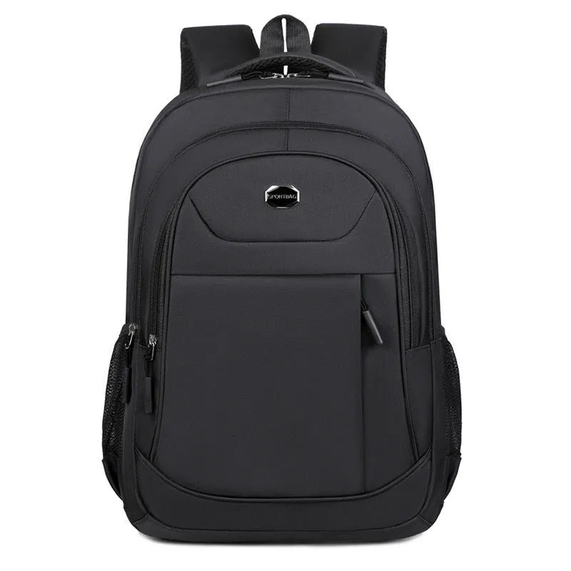 Solid colour Oxford cloth college backpack with curved shoulder straps, shown in black.