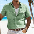 Men's loose fit cotton summer shirt in a solid colour on a hanger