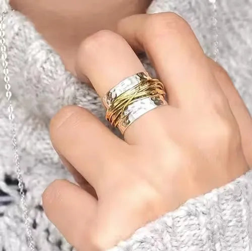 Alloy hammered metal coil ring with electroplated two-tone finish available in sizes 6 to 10