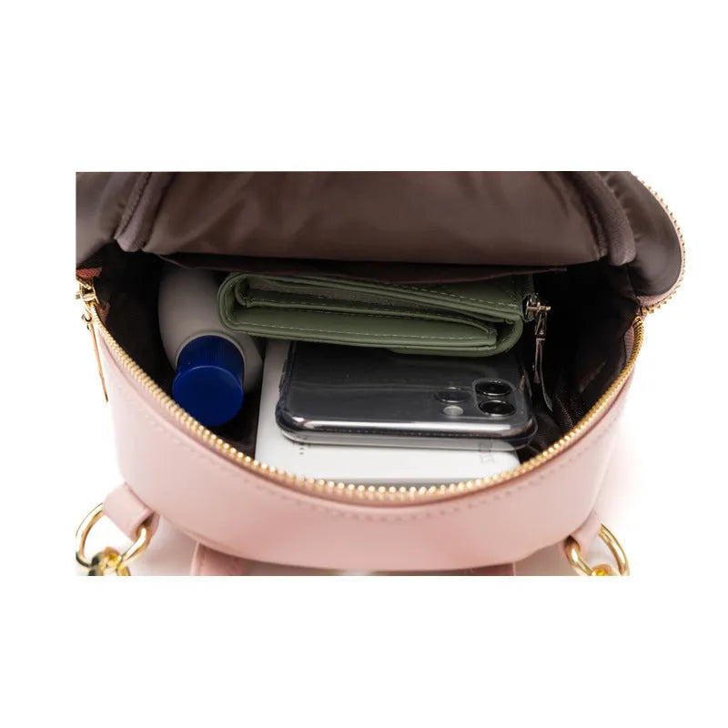 Soft PU mini backpack in street style, shown in one of six colours with contrast details and external 3D pocket.