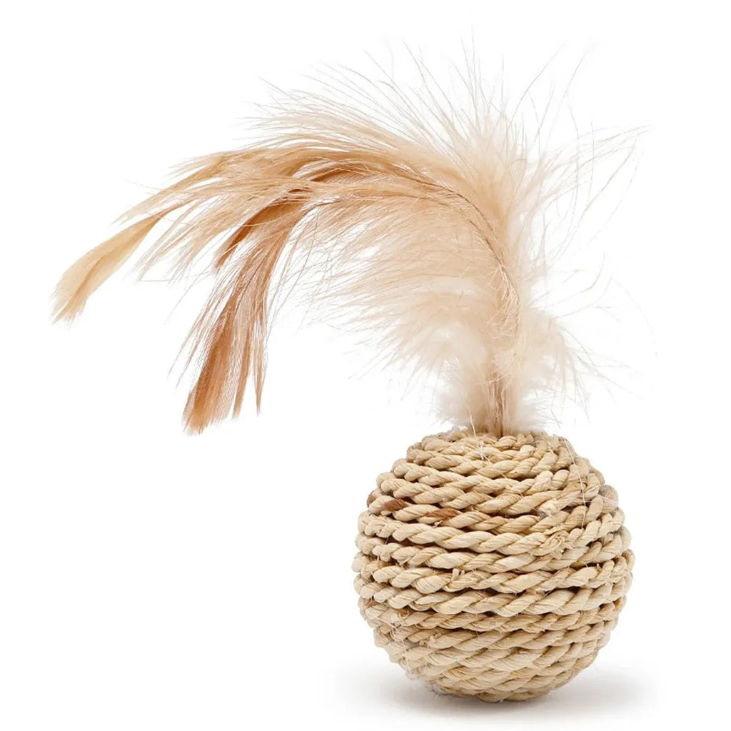Two cat toys: a faux feather bell ball and a hollow rattan ball on a plain background.