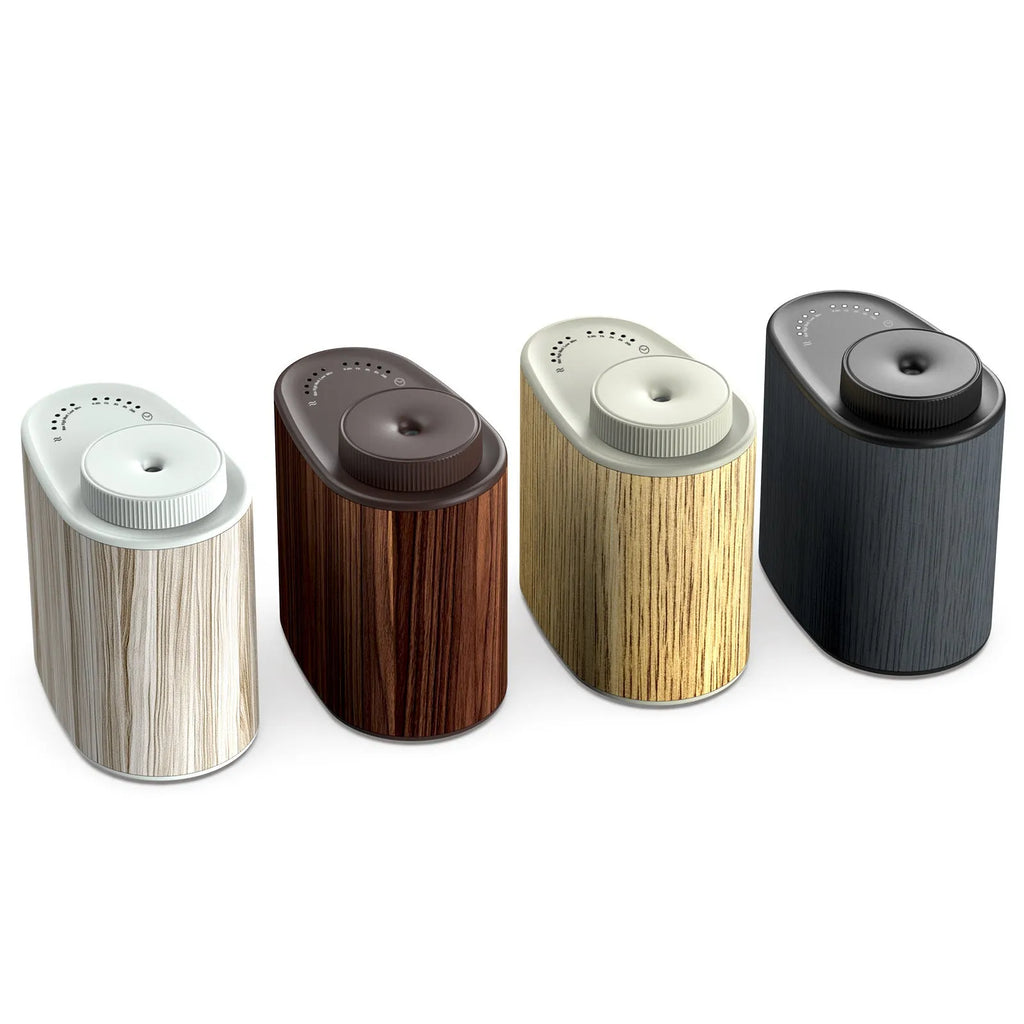 Creative nebulizing diffuser automatic aerosol dispenser with round plastic body, black wood texture finish, USB cable