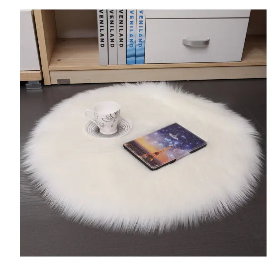 Round plush machine-woven carpet in beige on a wooden floor, 35cm diameter