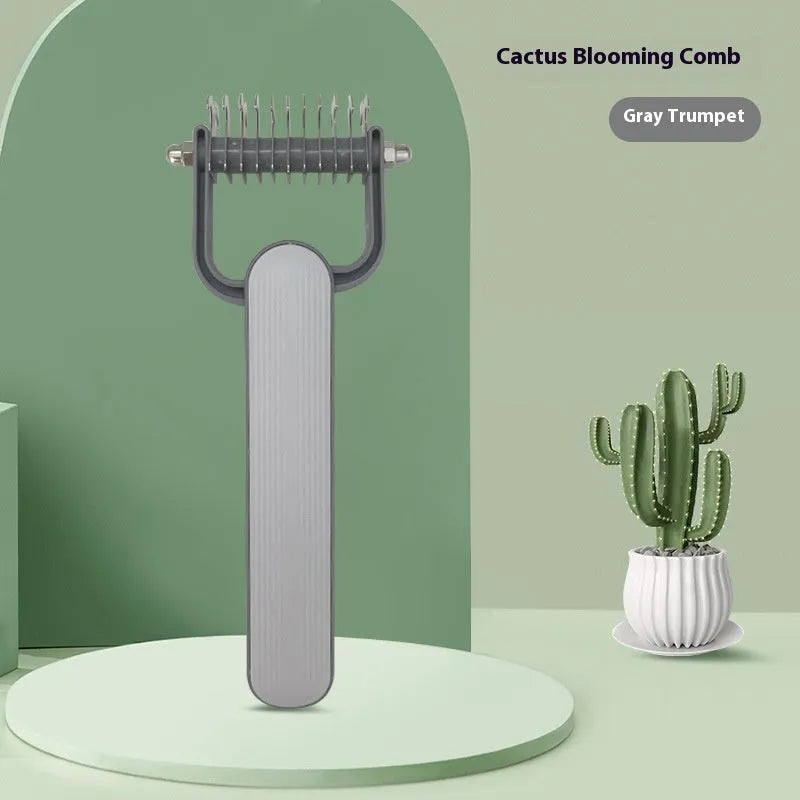 Green pet detangling comb with stainless steel teeth and plastic handle