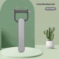 Green pet detangling comb with stainless steel teeth and plastic handle