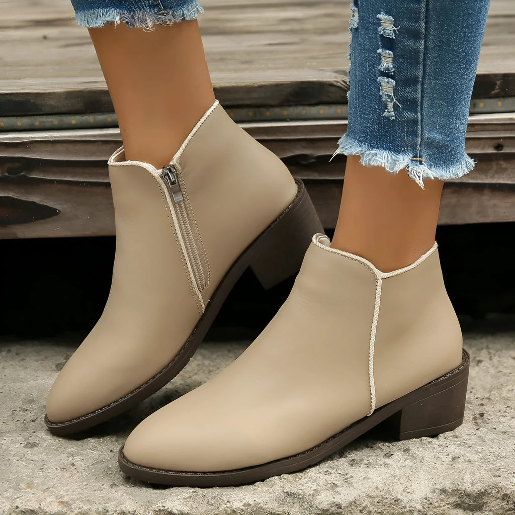 Women's chunky mid heel suede ankle boots with side zipper in off-white, front view