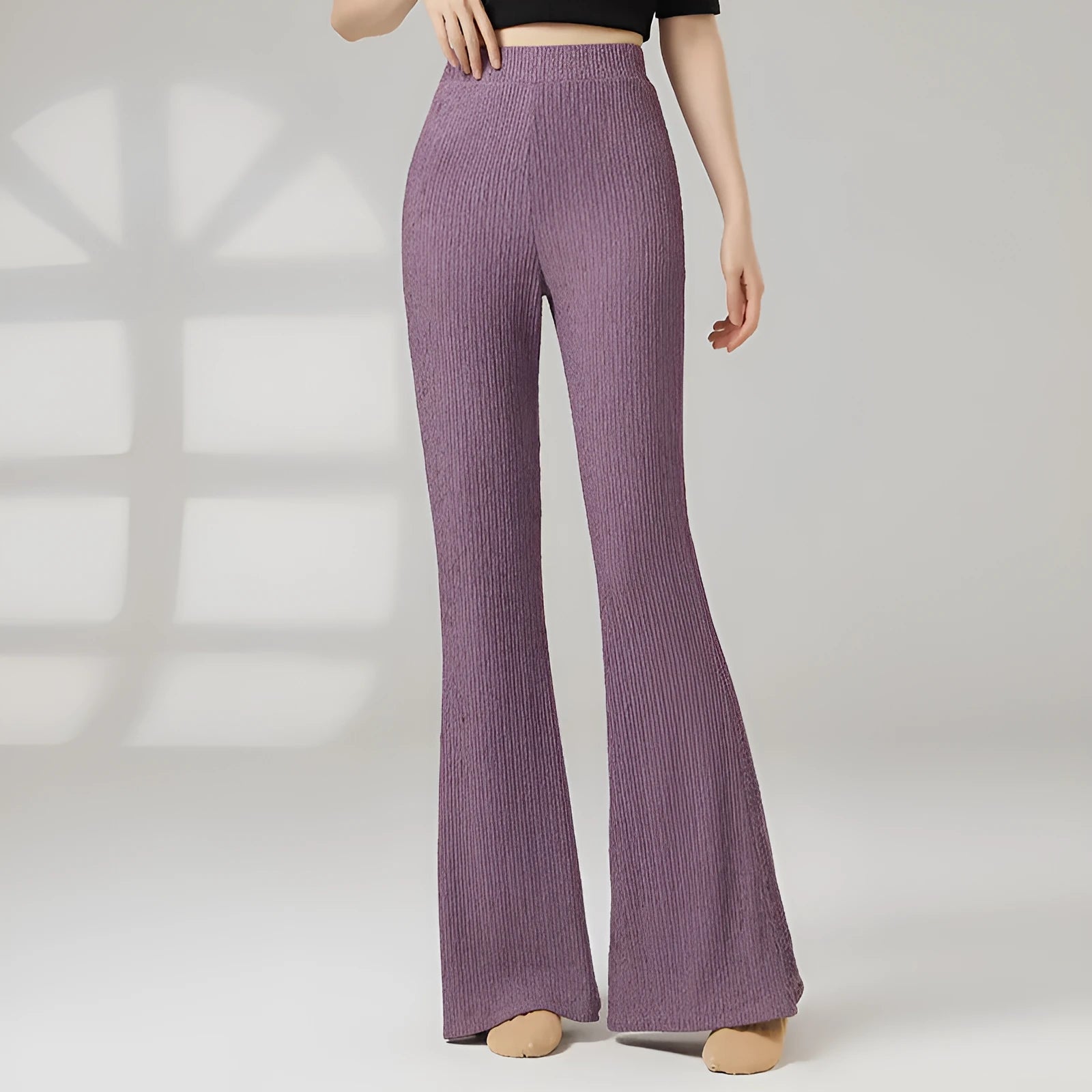 Women's solid colour dance practice pants in stretch polyester fabric on a hanger.