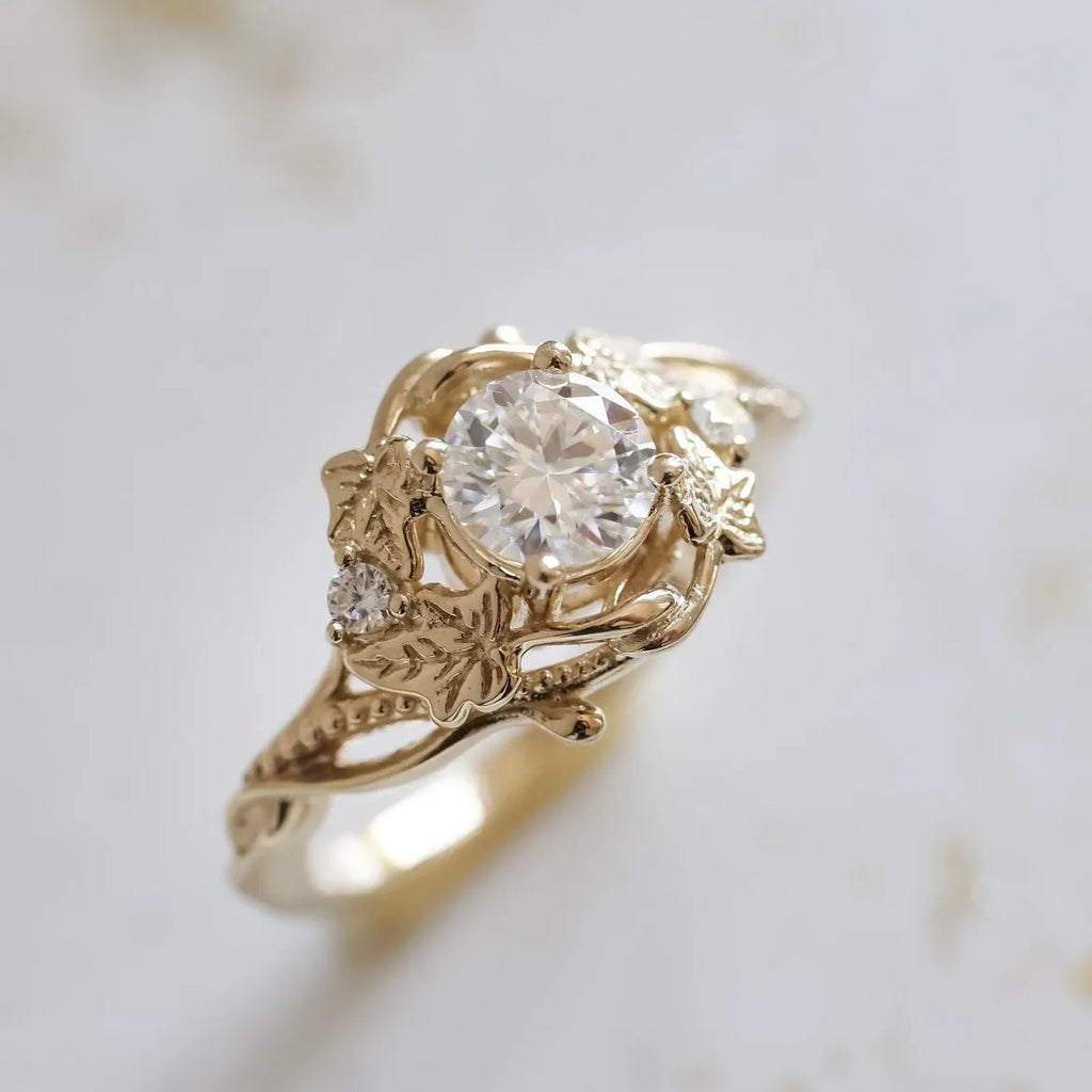 Gold alloy ring with brushed finish on neutral background