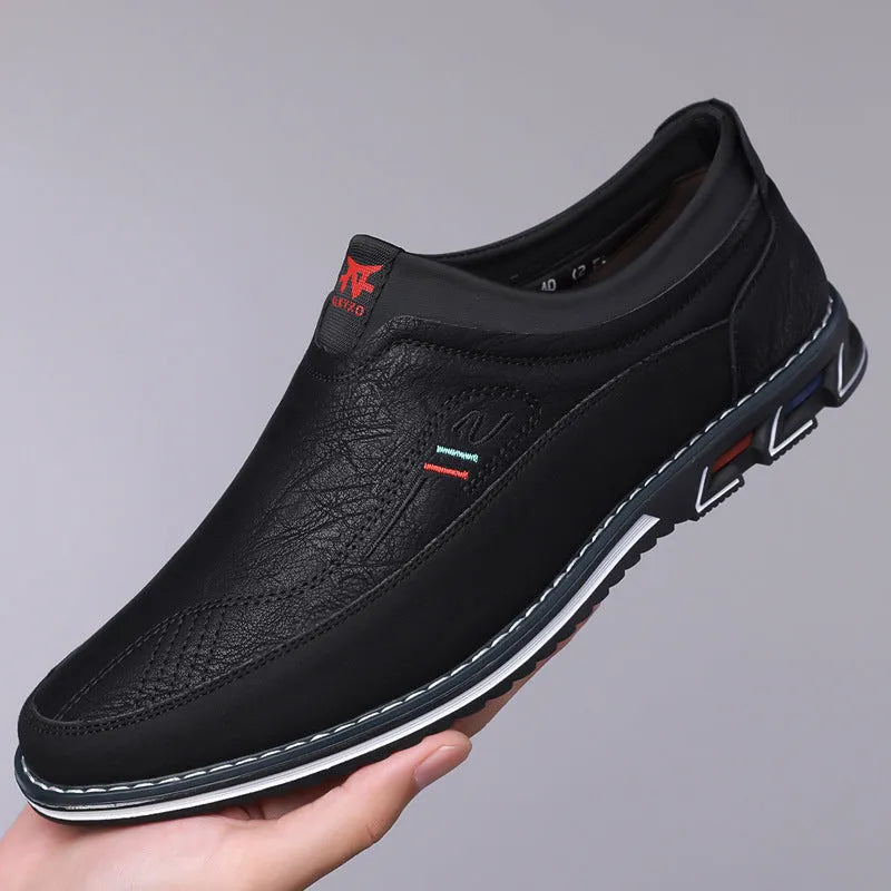 Men's casual leather shoes in black with a fabric upper, leather toe cap, rubber sole, and decorative stitching.