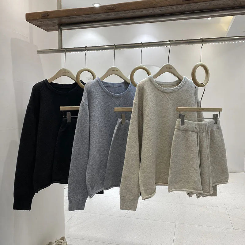 Women's loose-fitting long sleeve sweater and wide-leg shorts two-piece set in a neutral colour.
