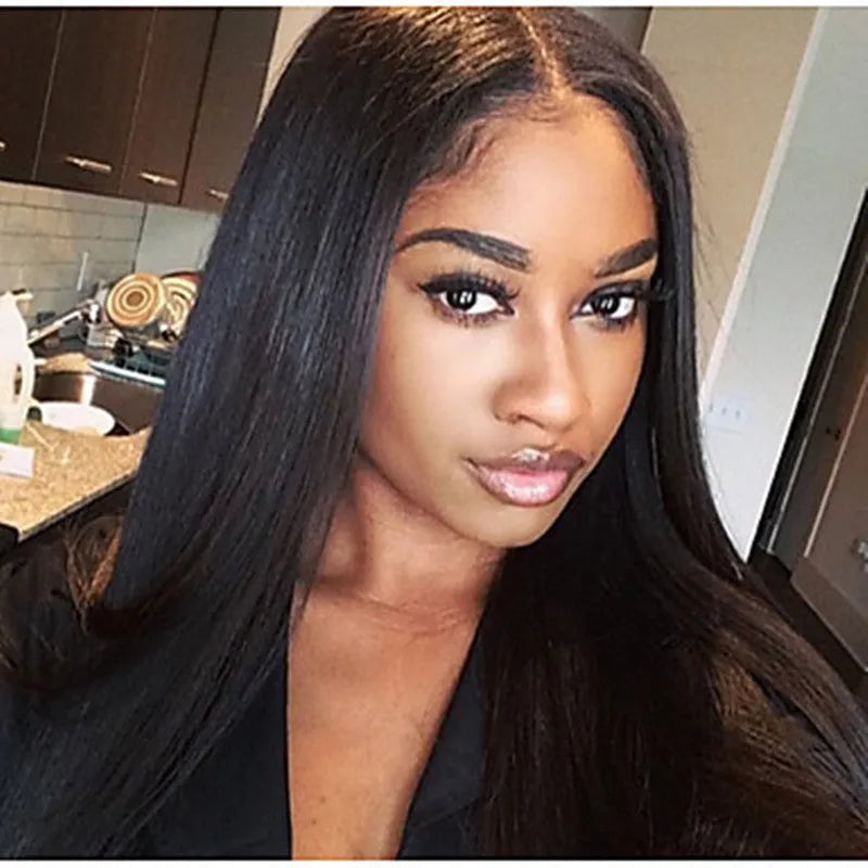Long straight black synthetic wig with centre-parted bangs on a hair cover.