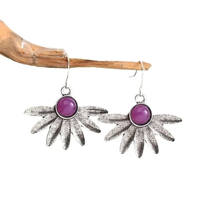 Purple Bohemian style drop earrings with resin gemstone accents and animal zodiac design on alloy framework