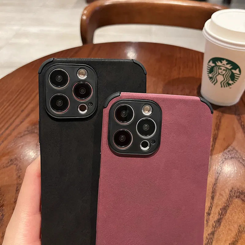 Simple solid colour fur phone case with imitation leather texture for iPhone fall prevention, available in black, blue, and green