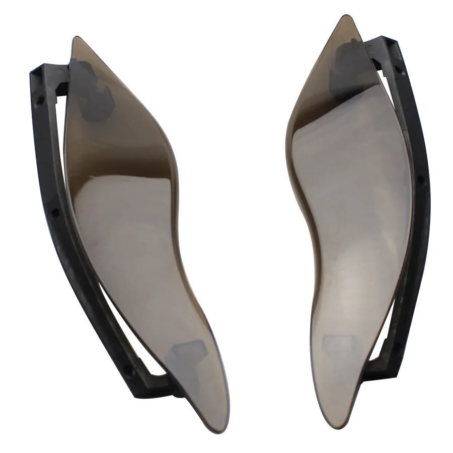 Pair of smoked ABS plastic motorcycle side wing panels for Harley trike models.