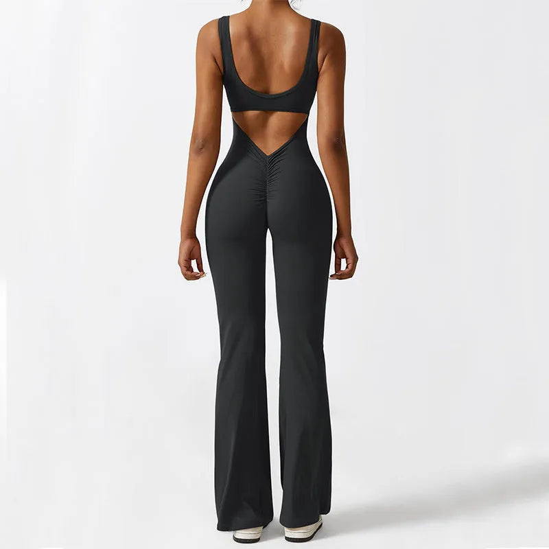 Women's sleeveless flare leg jumpsuit for yoga in high-elasticity polyester fabric.