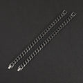 Silver titanium steel geometric bracelet with 10mm width on a neutral background