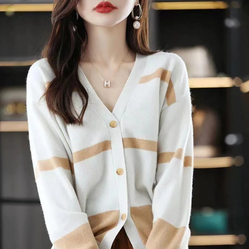 Women's black and white striped V-neck knitted cardigan with 3D pattern and buttons.