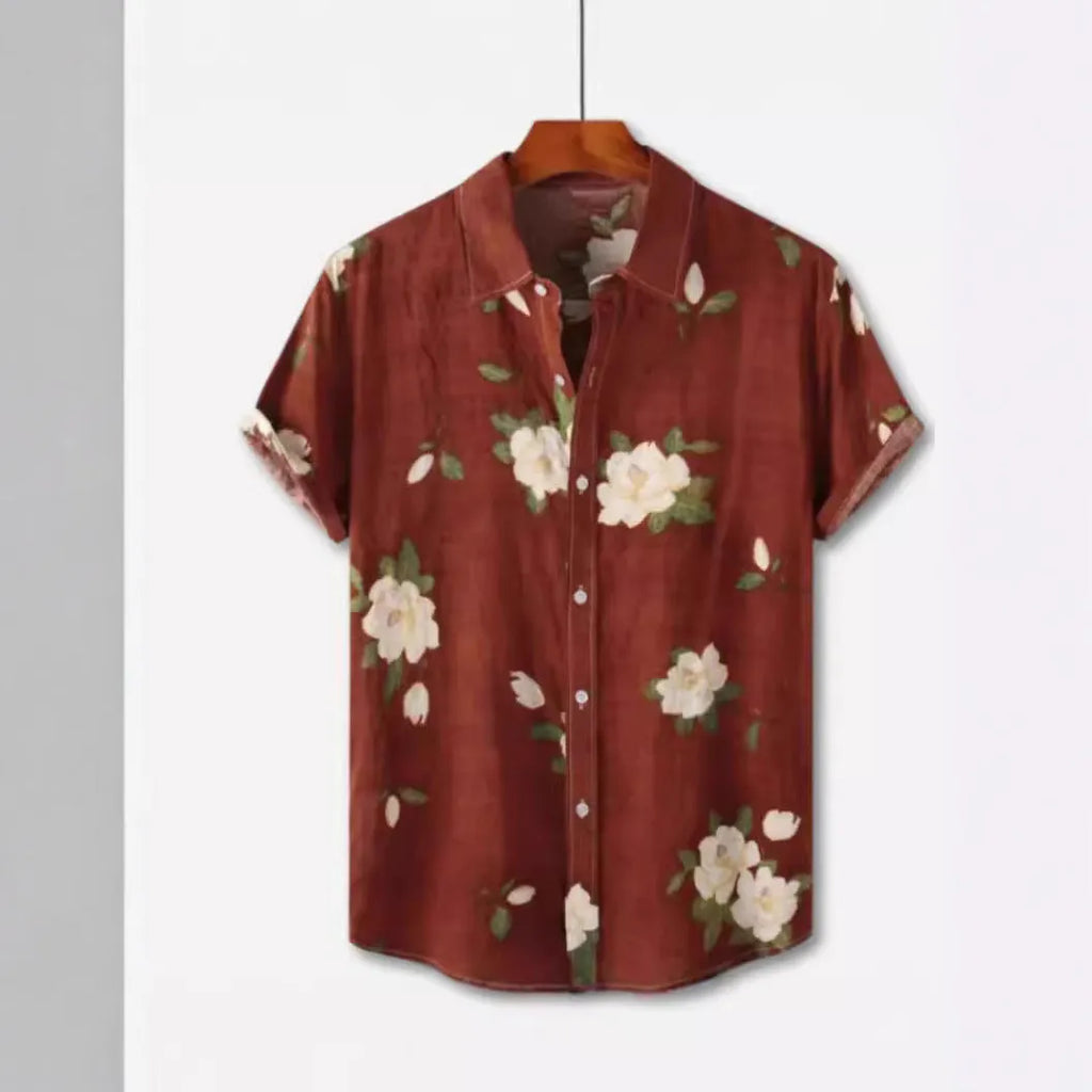 Man wearing a short sleeve Hawaiian print shirt with floral pattern and elastic fabric.
