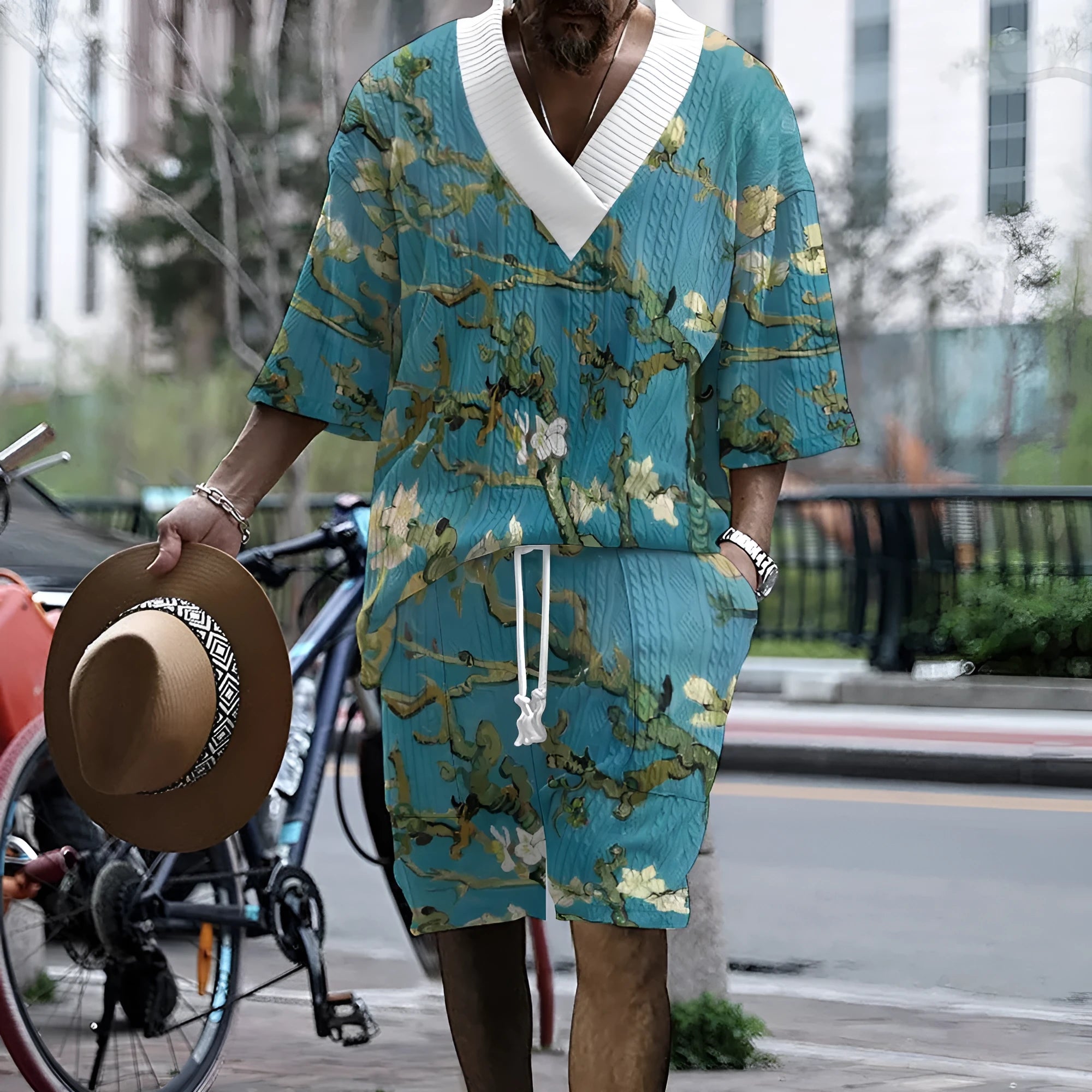 Men's peacock blue 3D printed knitted shorts suit with matching T-shirt, showing fifth-pant length trousers