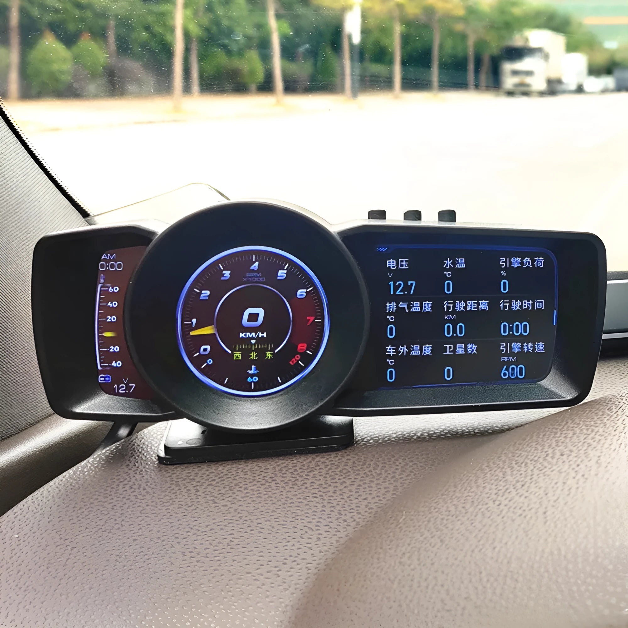 A600 monitor driving computer with TFT screen next to OBDII cable and installation tools.
