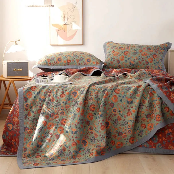Cotton gauze three-piece blanket set with floral pattern and matching pillowcases for bed