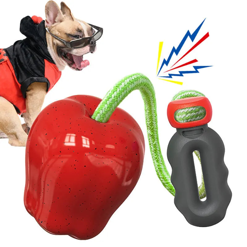 Green plastic apple-shaped dog toy with molar texture, acting as a food-dispensing ball and chew.