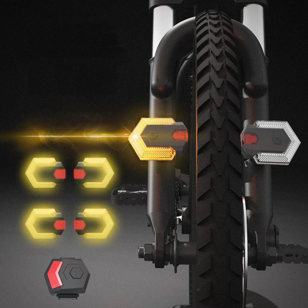 Black wireless bicycle turn signal set with remote control and USB charging cable on a bike frame
