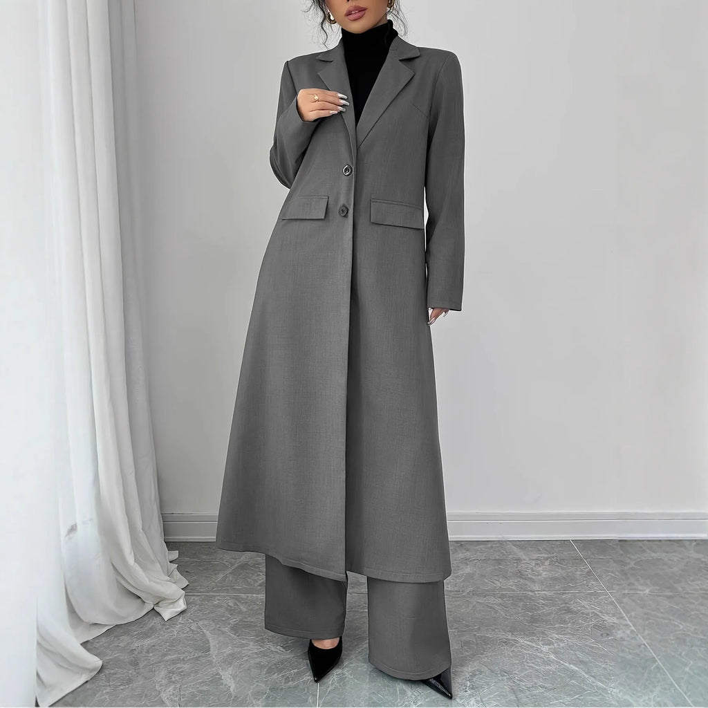 Women's gray polyester two-piece suit with long jacket and trousers on mannequin