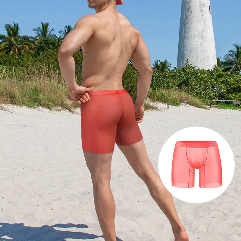 Men's low-waist boxers in orange, pink, and red made from breathable ice silk nylon fabric.