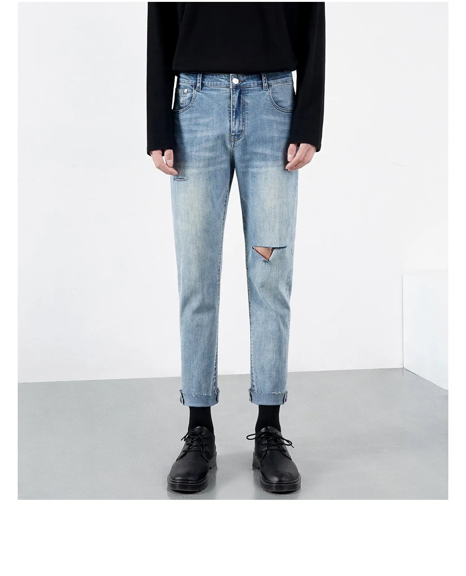 Men's light blue ripped jeans with microelastic cotton blend fabric, shown flat for size reference