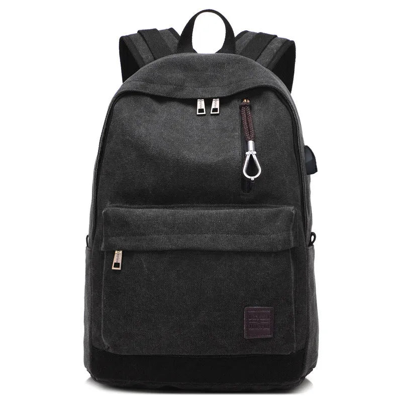 Canvas backpack with USB charging port and multiple pockets including a laptop compartment