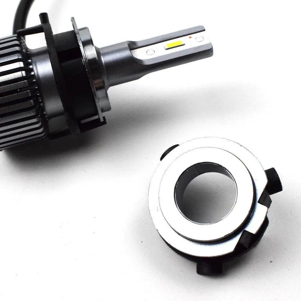 White ABS plastic car LED headlight bulb holder on a grey background.