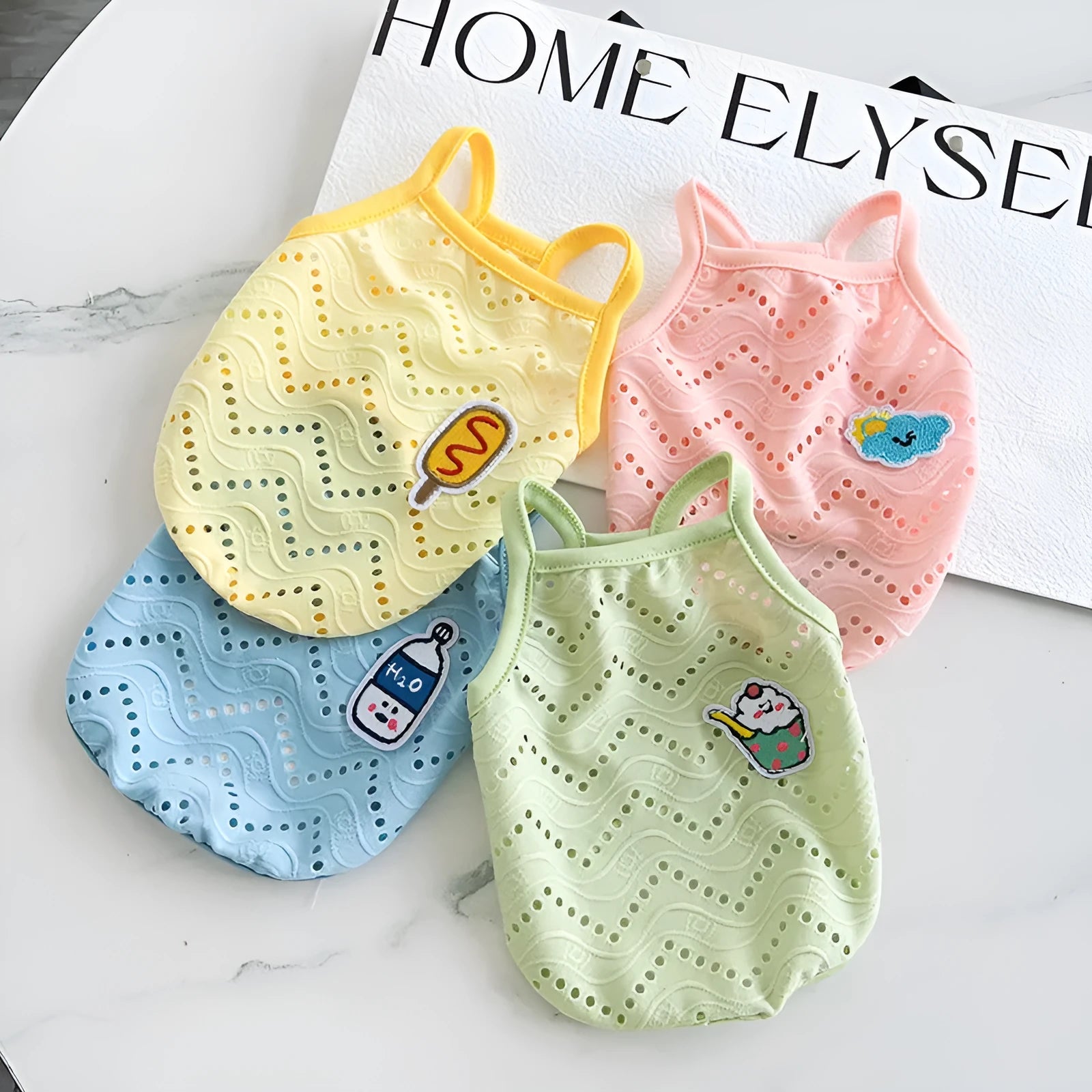 Dog wearing blue mesh cooling vest with adjustable camisole-style straps