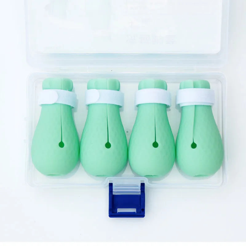 Four bright green silicone cat scratch protection gloves for pet handling.