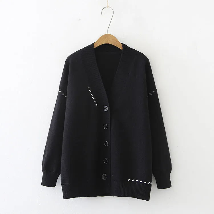 Women's knitted cardigan coat in black with loose fit and long sleeves