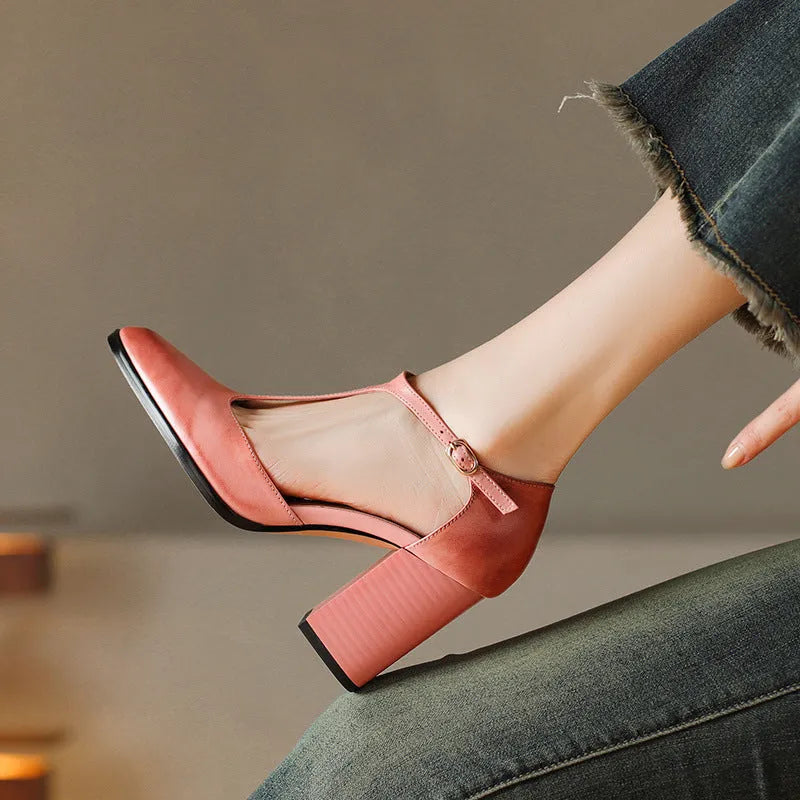 Women's dark brown retro pointed Mary Jane shoes with a hollow toe design and a buckle fastening.