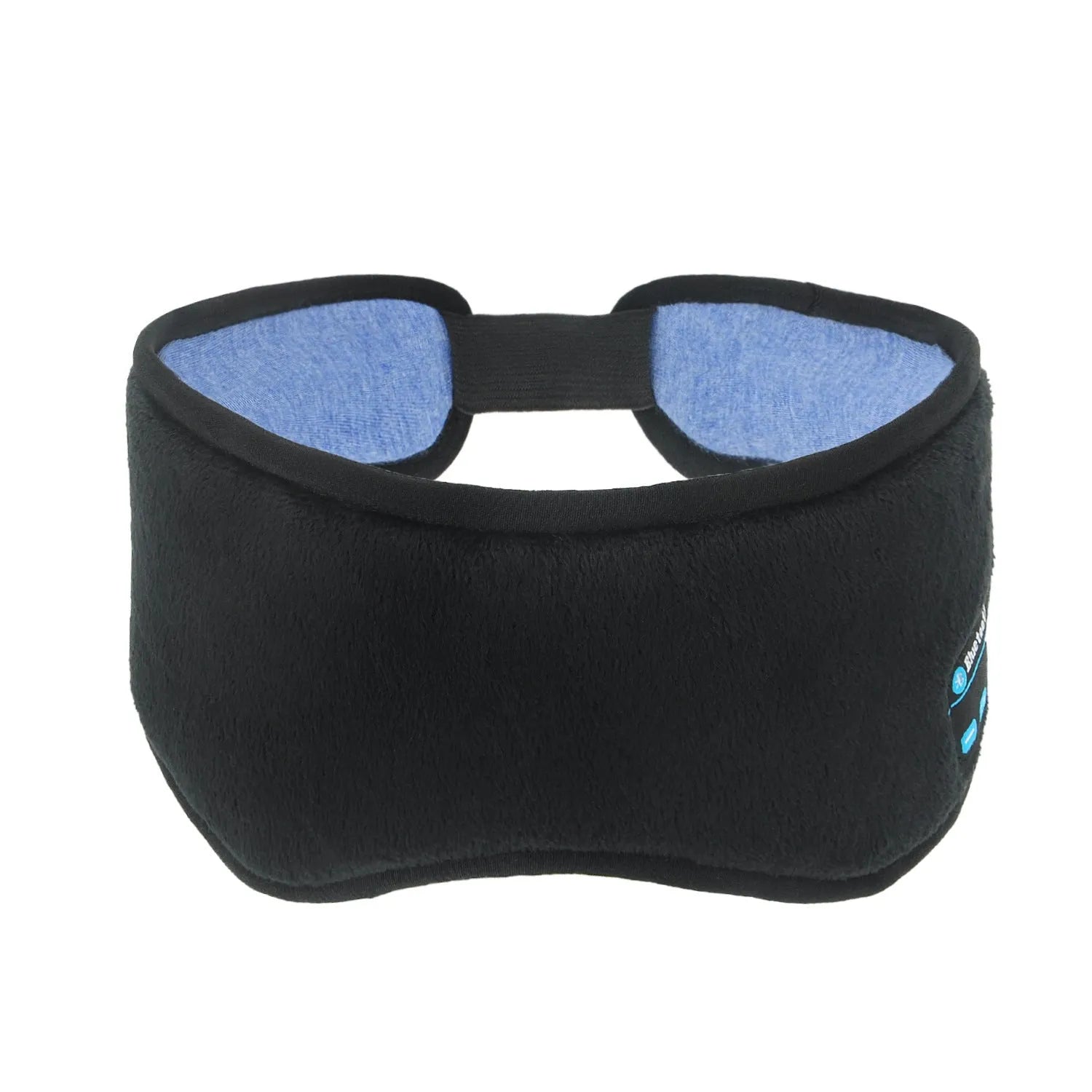 Black Bluetooth sleep mask with built-in speakers lying flat on a surface with a charging cable.
