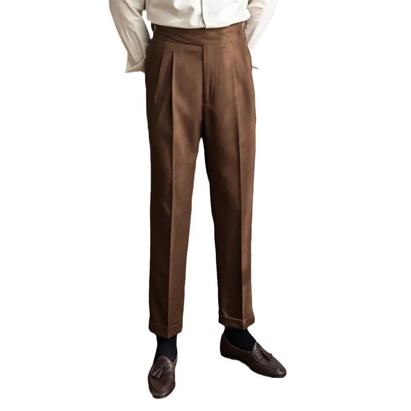 Man wearing black high waist straight leg casual trousers made from polyester fabric.