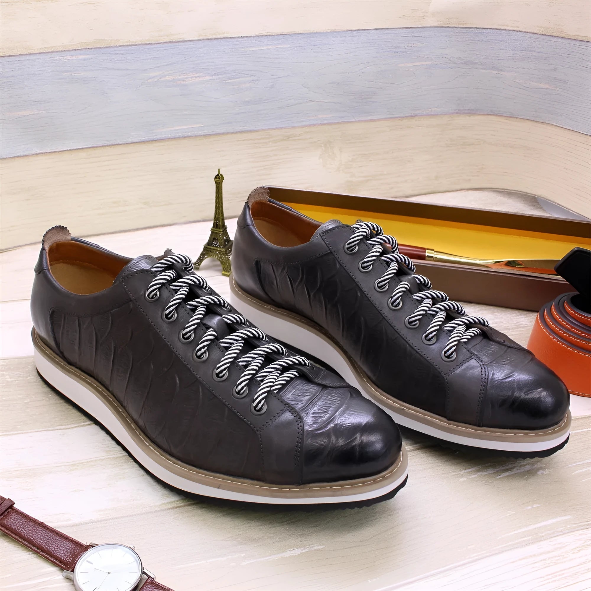Men's black embossed pattern low-top casual shoes with lace-up front and textured upper.