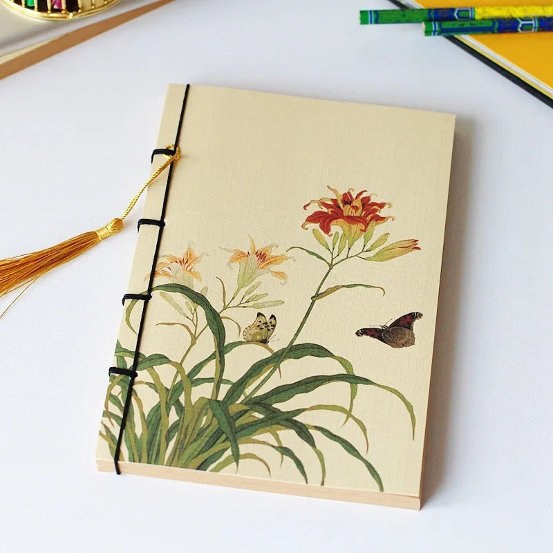 A5 antique thread-bound notebook with embossed cover and decorative tassels