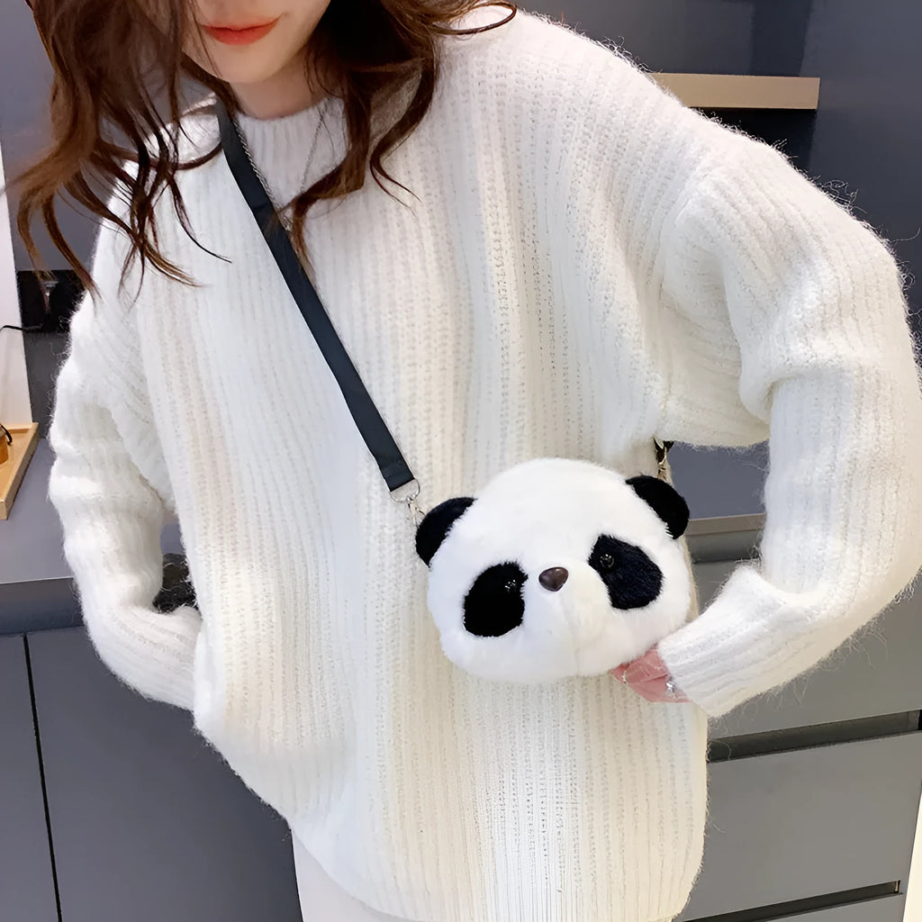 Soft plush crossbody bag with panda head design, cylindrical shape, and sandwich pocket