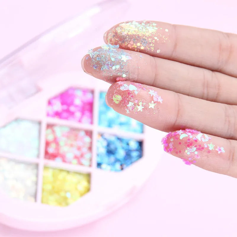 Small pot of glitter eye shadow gel cream with shimmer sequins in seven colour options for face and body festival use