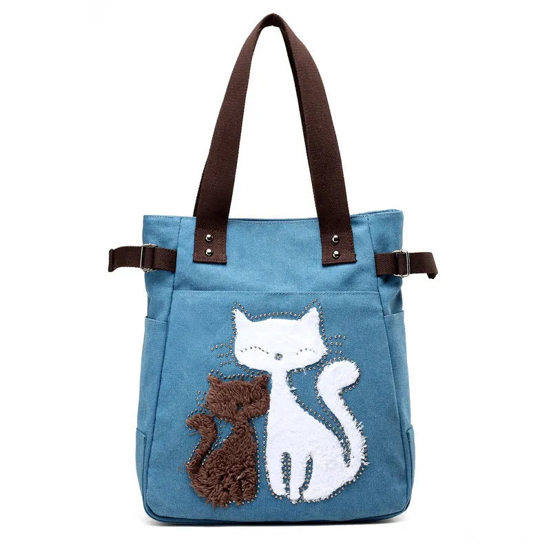 KVKY women canvas shoulder bag with cute plush cat applique in beige colour on white background