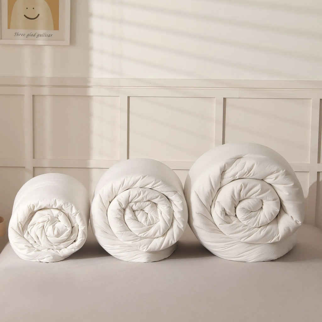 Soybean fibre quilt with pure cotton cover in white, pink jade, or grey, shown in various sizes.