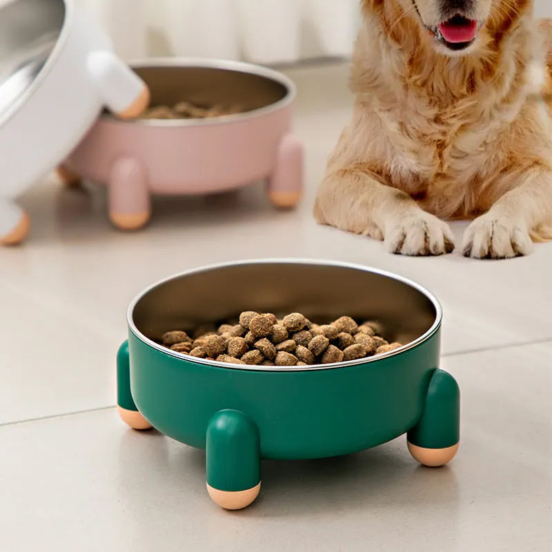 Green high-footed non-slip stainless steel bowl for dogs and cats on a floor.