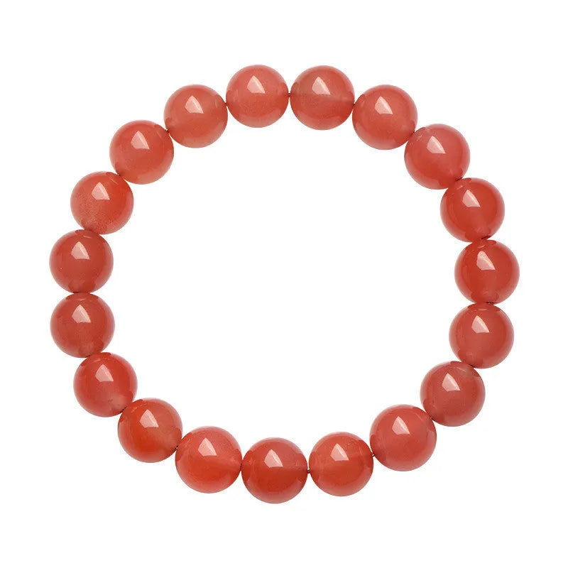 Natural South Cherry Red Agate polished bead bracelet shown in a scattered design on a wrist.