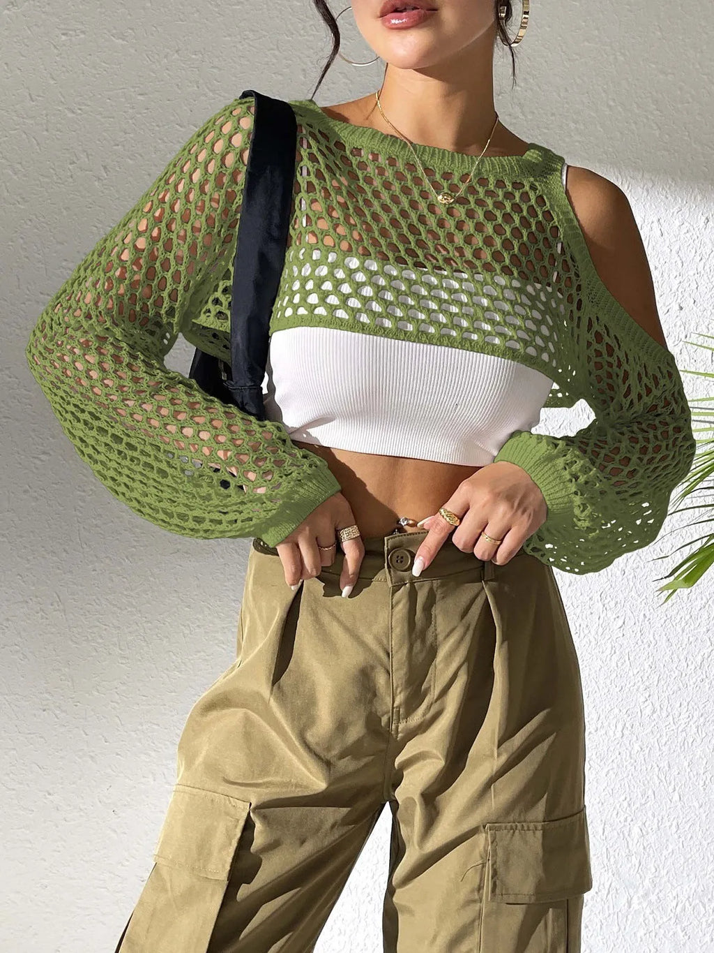 Mesh shirt with hollow navel design in polypropylene fibre, shown in one of six colours.