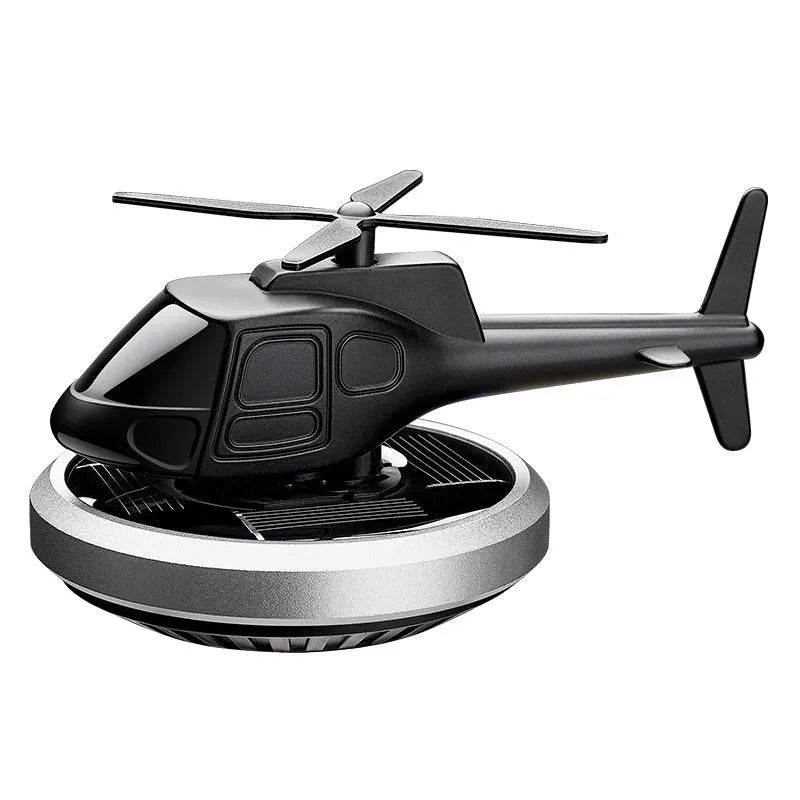 Silver solar-powered metal helicopter car ornament with rotating blades and air freshener function.