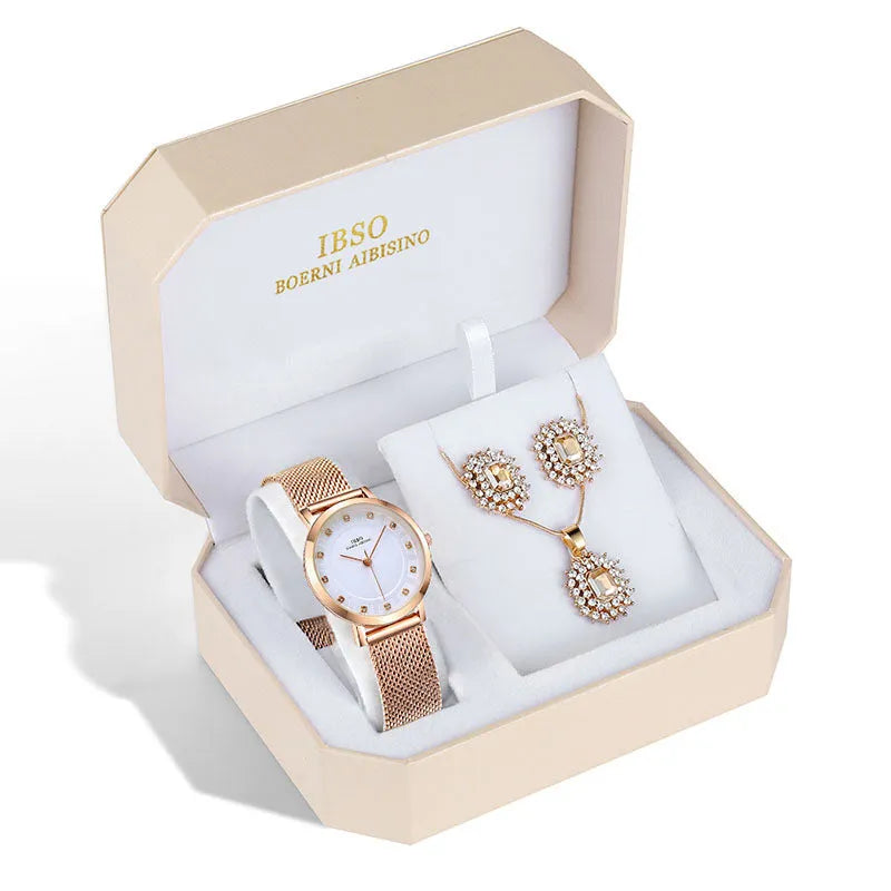 Women's quartz watch and jewellery set with 30mm dial, silver case, and stainless steel buckle, on a white background